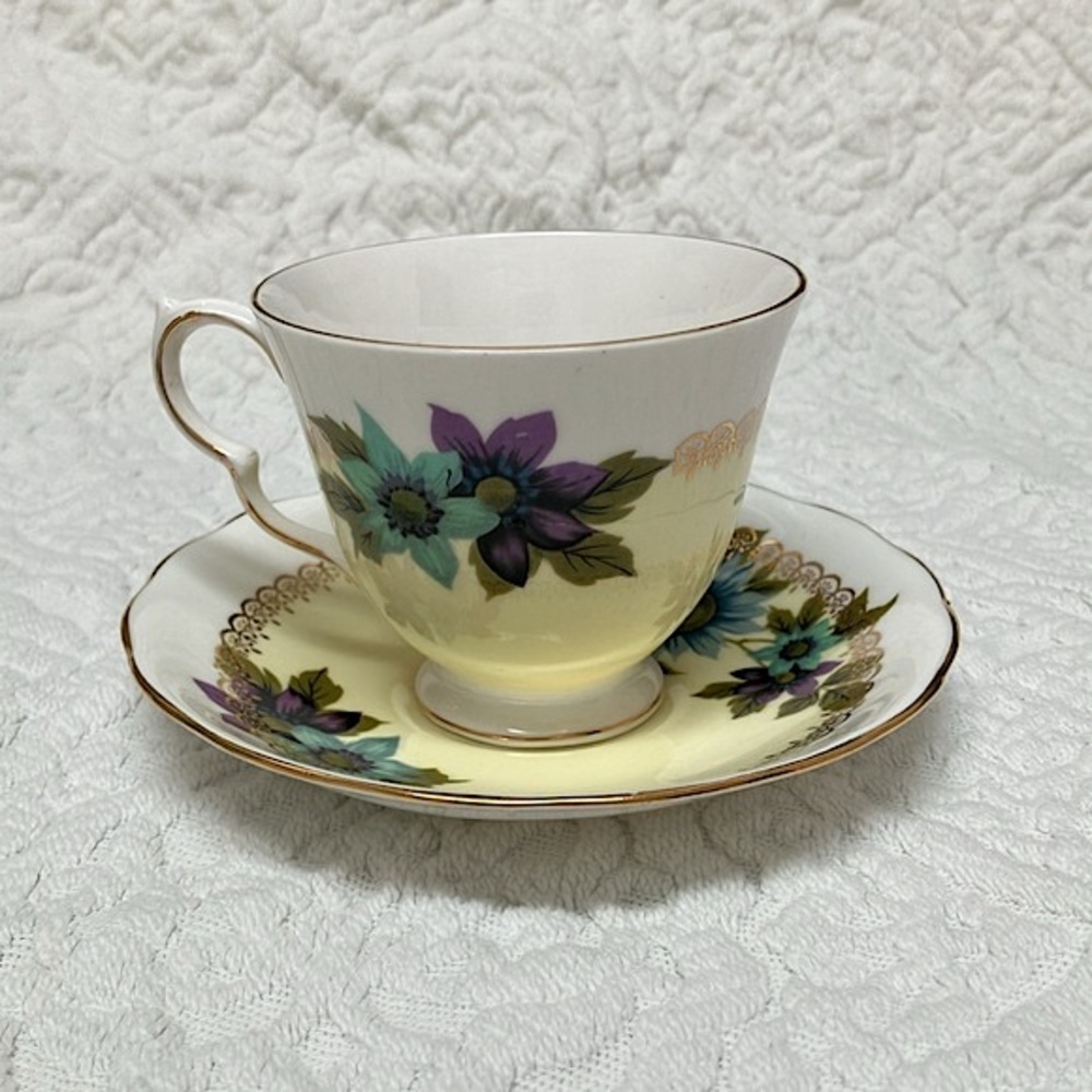 Queen Anne bone china vintage tea cup and saucer, blue daisy with yellow, purple
